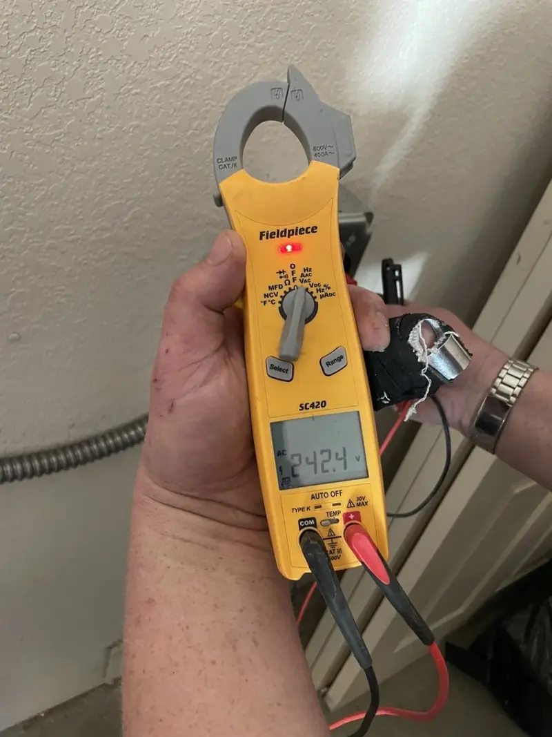Voltage testing with clamp meter during Whole House Surge Protector in North Sewickley